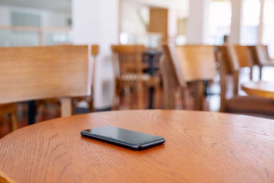 a-black-mobile-phone-on-the-table 540x360